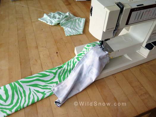 Cut another piece 12x10 inches. Fold over so it's 6x10 inches and sew along the 10 inch length, making a tube that is open on each 6 inch side.  Pin both thickness of the 10 inch side to one thickness at the end of the 24 inch tube, leaving the 24 inch tube open at both ends.
