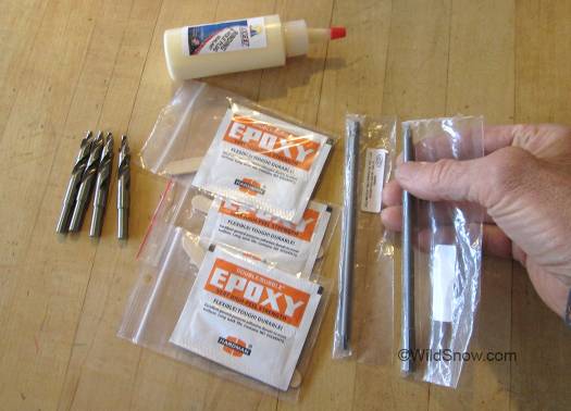 Ski tools: bits to left, Hardman epoxy, nice long pozi bits for reaching tightly placed binding screws, and some wood-glue type adhesive (top) that's probably just waterproof Titebond. Ski tools: bits to left, Hardman epoxy, nice long pozi bits for reaching tightly placed binding screws, and some wood-glue type adhesive (top) that's probably just waterproof Titebond.