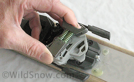 First step to reassembly is to pop in this stripped down version of the parts. Place the rear in first, compress the springs, and press the front yoke down and in. The small nut shown in photos above must seat in its dedicated slot. Check by viewing binding from side. First step to reassembly is to pop in this stripped down version of the parts. Place the rear in first, compress the springs, and press the front yoke down and in. The small nut shown in photos above must seat in its dedicated slot. Check by viewing binding from side.