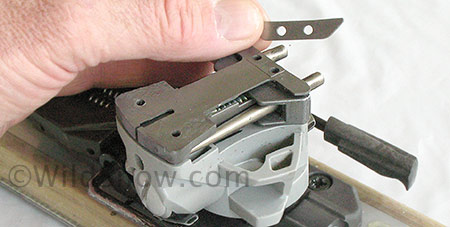 Don't forget any parts. This small metal plate, the slide liner, is easy to overlook. You can slide it in at any time in the process before running the screws back in. Once everything is in, press all together with your fingers and make sure it feels solid and completely assembled. Replace the top plate and associated small steel reinforcing plate (obvious) and run the screws back in. Gently snug the screws in a cross pattern, then torque down firmly but with much less force than you'd use for most other fasteners. Don't forget any parts. This small metal plate, the slide liner, is easy to overlook. You can slide it in at any time in the process before running the screws back in. Once everything is in, press all together with your fingers and make sure it feels solid and completely assembled. Replace the top plate and associated small steel reinforcing plate (obvious) and run the screws back in. Gently snug the screws in a cross pattern, then torque down firmly but with much less force than you'd use for most other fasteners.