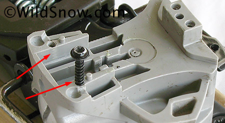 If you're working on high mileage bindings, inspect housing for cracks in areas indicated by arrows. If the housing is cracked it won't hold the screws securely and must be replaced before mission critical use. Know that with some TLT moldings there may be a tiny gap adjacent to the screw hole; this is not a crack and not a concern. (Screw inserted to illustrate, not as part of assembly sequence.) 