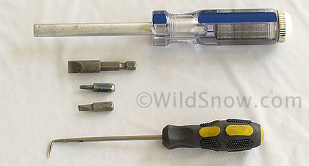 These are all the tools you need for disassembly of the Dynafit heel, but to do the job right you should have each one. From top: screwdriver bit holder, large slot bit, #10 Torx bit, small slot bit and right angled pick. Find the largest flat/slot bit possible for turning the rear spring adjustment barrel.