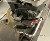 Version 2 Dynafit anti rotation stop is mounted on the brake parts, indicated by arrow.