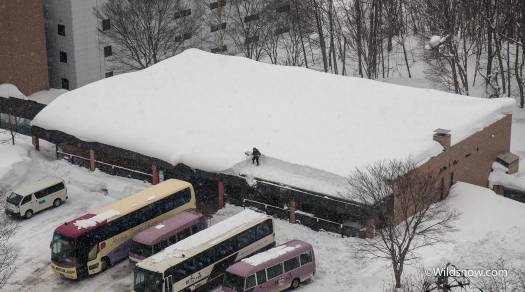Snow clearing is a gargantuan undertaking on Hokkaido. It seems to run like a well oiled machine most of the time, but this guy looked like he had his work cut out for him clearing this entire roof by hand. Snow clearing is a gargantuan undertaking on Hokkaido. It seems to run like a well oiled machine most of the time, but this guy looked like he had his work cut out for him clearing this entire roof by hand.