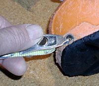 Cleaning the boot socket with the cute little tool mounted on a safety strap. A 16d nail also works well for this. Cleaning the boot socket with the cute little tool mounted on a safety strap. A 16d nail also works well for this.