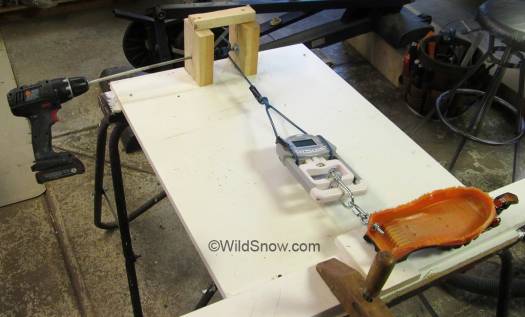 Another view of the rig. Drill turns a simple windlass that pulls the test. I found that with a light touch on the drill I could pull at a gentle constant pressure that gave consistent readings. Another view of the rig. Drill turns a simple windlass that pulls the test. I found that with a light touch on the drill I could pull at a gentle constant pressure that gave consistent readings.