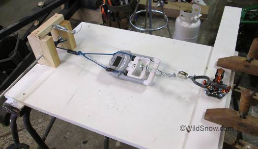 Our pull tester rigged to simply check binding opening force. Our pull tester rigged to simply check binding opening force.