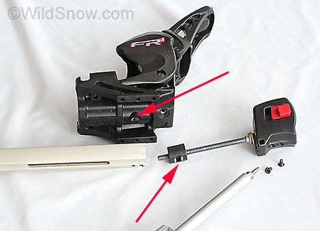Next, we remove two small screws from the cap at the end of the rail, then easily slide the cap and length adjustment rod out of the hollow rail. Arrow indicates location of screw that mates heel unit with length adjustment rod. Next, we remove two small screws from the cap at the end of the rail, then easily slide the cap and length adjustment rod out of the hollow rail. Arrow indicates location of screw that mates heel unit with length adjustment rod.