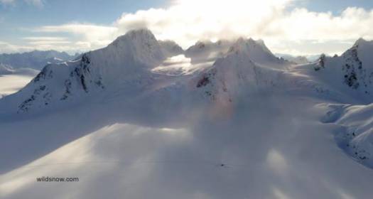Our camp as seen from the top of the last run of the day on the “camp wall”. You can see our camp as the dot in the lower center of the photo. Most of our skiing has been on the north faces of the peaks in the background. Our camp as seen from the top of the last run of the day on the “camp wall”. You can see our camp as the dot in the lower center of the photo. Most of our skiing has been on the north faces of the peaks in the background.
