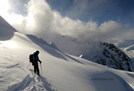 Jason about to get some sunny pow skiing below Tomahawk. Jason about to get some sunny pow skiing below Tomahawk.