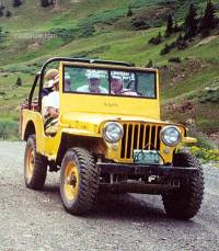 My uncle's yellow Willys inspired us to obtain and "restore" our own. This is he and family wheeling near Crested Butte, Colorado.