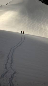 Jotunheimen Mountains, Norway. Stian Hagan and Greg Grenzke deep in discussion about the new Arcteryx 'double tracker' shell with a revolutionary 'snap sleeve' for attaching to your partner while simultaneously skiing. Jotunheimen Mountains, Norway. Stian Hagen and Greg Grenzke deep in discussion about the new Arcteryx 'double tracker' shell with a revolutionary 'snap sleeve' for attaching to your partner while simultaneously skiing.
