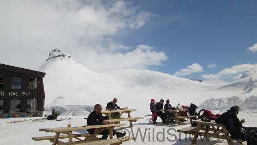 Patio area in front is formed by several meters of snow piled by a snowcat plow. This is co-owner Ole Grindvold enjoying the place. Always smiling, his leadership clearly has much to do with the happy spirit of the place. Patio area in front is formed by several meters of snow piled by a snowcat plow. To the left that is co-owner Ole Grindvold enjoying a brief rest. Always smiling, his leadership clearly has much to do with the happy spirit of the place.