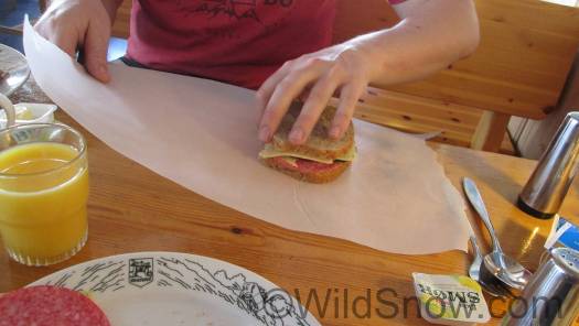 Sando is placed on a length of food wrapping paper available from a roll on the buffet counter.