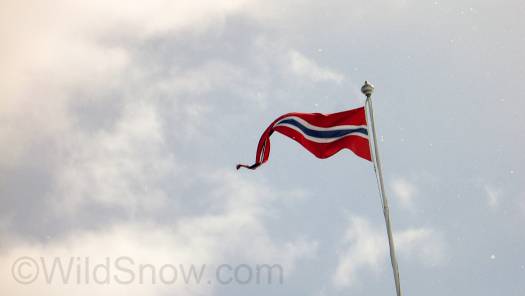 All hail Norway, land of glisse. Flag on the lodge. All hail Norway, land of glisse.