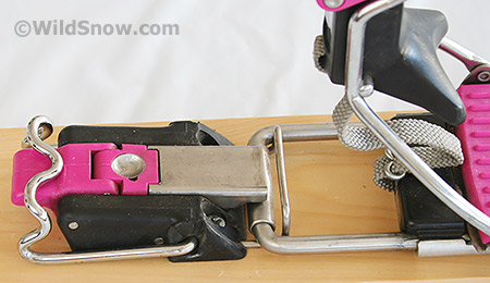 Switching from tour to ski mode is done with this simple latch, shown in ski mode. This is operable with a ski pole, and allows an excellent foot-flat-on-ski mode for long low-angled treks while backcountry skiing. View video of touring latch in action. Switching from tour to ski mode is done with this simple latch, shown in ski mode. This is operable with a ski pole, and allows an excellent foot-flat-on-ski mode for long low-angled treks while backcountry skiing. View video of touring latch in action.