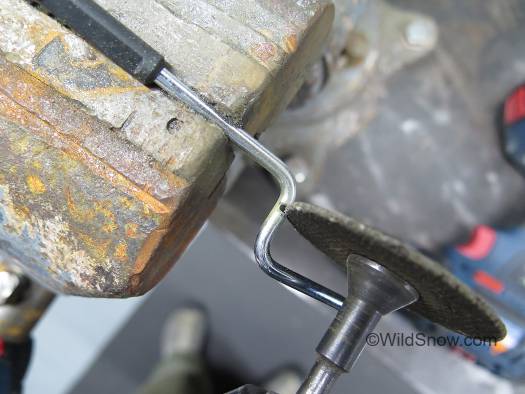 The brake has very little room at the bend where it enters the 'cage,' so I used a skinny cutoff wheel to make the cut. Brake arms are hardened steel. The brake has very little room at the bend where it enters the 'cage,' so I used a skinny cutoff wheel to make the cut. Brake arms are hardened steel.