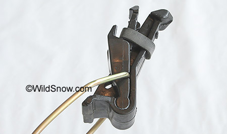 Heel clamp shown above. Note black rubber band that provides safety release tension for backcountry skiing. You add rubber bands to increase release tension. I doubt anyone has ever invented a ski binding vertical release mechanism this light. 