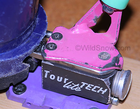 Detail showing how ends (rods/pins) of the release spring insert in the boot heel, which has a metal fitting the pins ride against. Detail showing how ends (rods/pins) of the release spring insert in the boot heel, which has a metal fitting the pins ride against.