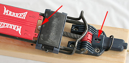 The M-Tour binding has two unusual adjustments. Arrow to left points to a nut you rotate to move the toe bail forward and backward, thus allowing exact placement of your boot for/aft position on the ski. I know of no other binding that has this feature. Very nice if you're sharing the binding among different people, or want to experiment with boot positions. The M-Tour binding has two unusual adjustments. Arrow to left points to a nut you rotate to move the toe bail forward and backward, thus allowing exact placement of your boot for/aft position on the ski. I know of no other binding that has this feature. Very nice if you're sharing the binding among different people, or want to experiment with boot positions.