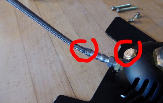 Our pump came with a kink in the hose, but it still works. Red circle to right indicates plug you remove to install the desiccant cartridge. Our pump came with a kink in the hose, but it still works. Red circle to right indicates plug you remove to install the desiccant cartridge.