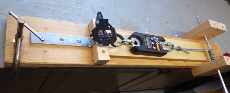 Our test rig uses a rope windlass to pull the binding open.
