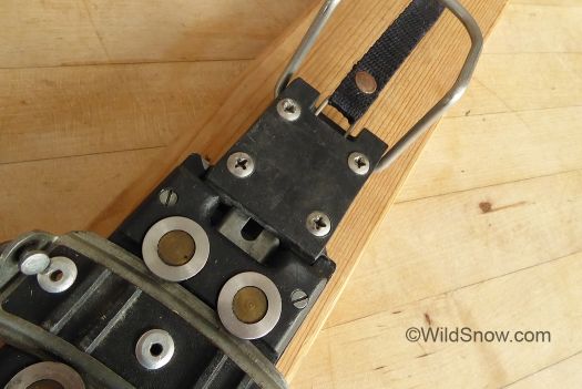 Frame is latched down with the small steel tab you can see between the two circular rollers. Frame is latched down with the small steel tab you can see between the two circular rollers.