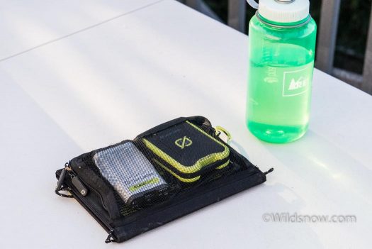 20160706-3 The kit packed up. The battery and charger fit neatly into the pocket on the back of the solar panel. Water bottle for scale.