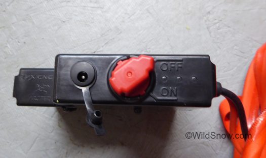 Red battery on-off switch , with charger port to left. Red battery on-off switch , with charger port to left.