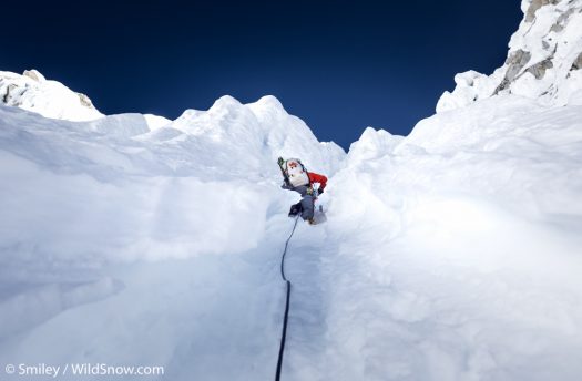 Mark putting the “mountaineering” in ski mountaineering. Climbing 75 degree ice runnels, with skis on one’s back, is no picnic. Every turn of the shoulders jabs a tip. That’s annoying on its own, but the shower of snow down the back of your neck is the sting in the tail. We finished these pitches, all at almost 19,000 feet mind you, soaked, cold, and worked. Mark putting the “mountaineering” in ski mountaineering. Climbing 75 degree ice runnels, with skis on one’s back, is no picnic. Every turn of the shoulders jabs a tip. That’s annoying on its own, but the shower of snow down the back of your neck is the sting in the tail. We finished these pitches, all at almost 19,000 feet mind you, soaked, cold, and worked.