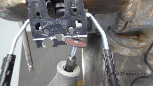 Cutting rear portion of brake base plate.