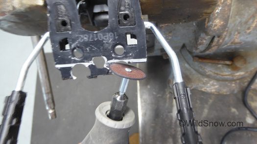 Cutting rear portion of brake base plate. Cutting rear portion of brake base plate.