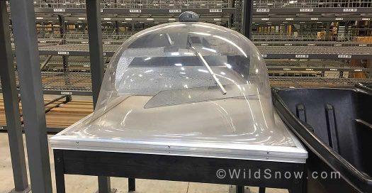 These skylights are all over the roof of the building. The dome protrudes above the roof, while a pyramid structure extends below the ceiling. The solar powered motor directs the sunlight onto a set of mirrors, which then maximizes the natural light inside the warehouse. These skylights are all over the roof of the building. The dome protrudes above the roof, while a pyramid structure extends below the ceiling. The solar powered motor directs the sunlight onto a set of mirrors, which then maximizes the natural light inside the warehouse.