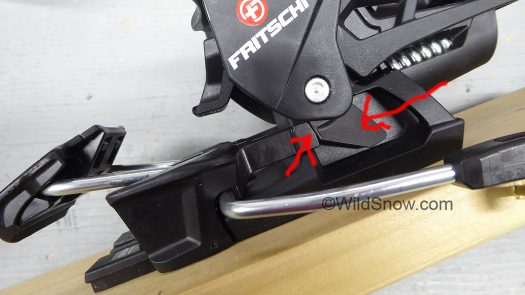 Tecton brake has a plastic prong (left arrow) that integrates with a cam (right arrow).
