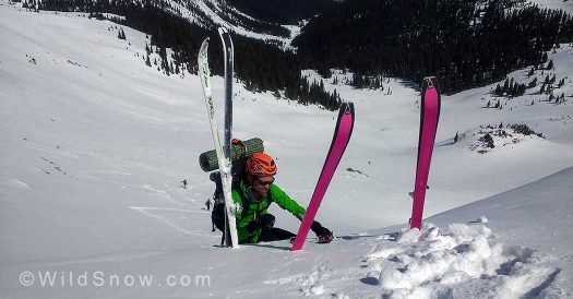 Using skis as handholds pulling over the cornice on New York Pass heading to the Friends Hut and Crested Butte Using skis as handholds pulling over the cornice on New York Pass heading to the Friends Hut and Crested Butte