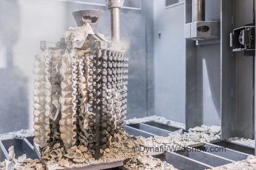 Once everything is cooled, the molds are vibrated in order to break the ceramic shells of the actual steel parts. Once everything is cooled, the molds are vibrated in order to break the ceramic shells off the actual steel parts.