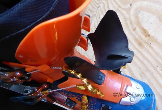 Another view of two part tongue, showing the black 'nib' that inserts in main tongue when buckled, adding significant beef to the boot flex. Another view of two part tongue, showing the black 'nib' that inserts in main tongue when buckled, adding significant beef to the boot flex.