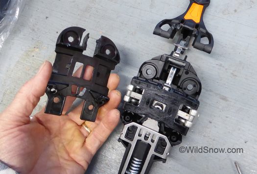 Plate removed, revealing what is easily the most awesome collection of mechanical engineering to ever grace a ski touring binding toe. Plate removed, revealing what is easily the most awesome collection of mechanical engineering to ever grace a ski touring binding toe.