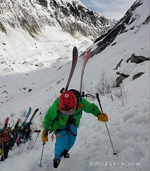 Everett climbing to the ridge and looking forward to putting the skis back on the feet.