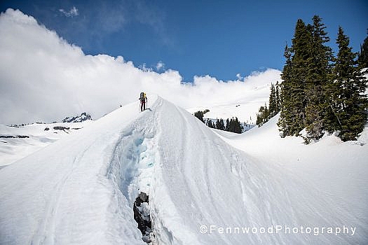Skinning up the moraine edge toward the Squak Glacier. Skinning up the moraine edge toward the Squak Glacier.