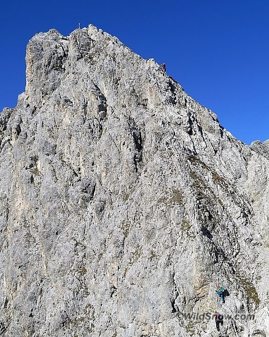 To keep things amusing, the start of the via ferrata is one of the more challenging parts of the trek. Note the tiny climbers. To keep things amusing, the start of the via ferrata is one of the more challenging parts of the trek. Note the tiny climbers.