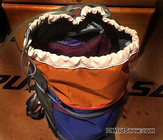 A zippered mesh pocket inside the main compartment acts as the cover flap for the hydration sleeve, and provides storage space for snacks or tools. A sleeve is provided for a hydration bladder, but there is no insulation for the hose. I used an Osprey bladder with a formed reservoir to give the pack enough shape and support to stand up more readily while accessing the main compartment. Using a simple slit-style bite valve avoided some of the freezing issues that beset more complicated on/off valves. A zippered mesh pocket inside the main compartment acts as the cover flap for the hydration sleeve, and provides storage space for snacks or tools. A sleeve is provided for a hydration bladder, but there is no insulation for the hose. I used an Osprey bladder with a formed reservoir to give the pack enough shape and support to stand up more readily while accessing the main compartment. Using a simple slit-style bite valve avoided some of the freezing issues that beset more complicated on-off valves.