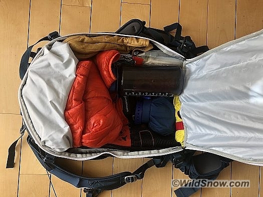 With the airbag system taking up minimal space there is ample room in the main compartment. Here I’ve got a rescue sled, repair kit, first aid kit, water, gloves, micro-puff, snow-study kit, and snacks with room to spare. With the airbag system taking up minimal space there is ample room in the main compartment. Here I’ve got a rescue sled, repair kit, first aid kit, water, gloves, micro-puff, snow-study kit, and snacks with room to spare.