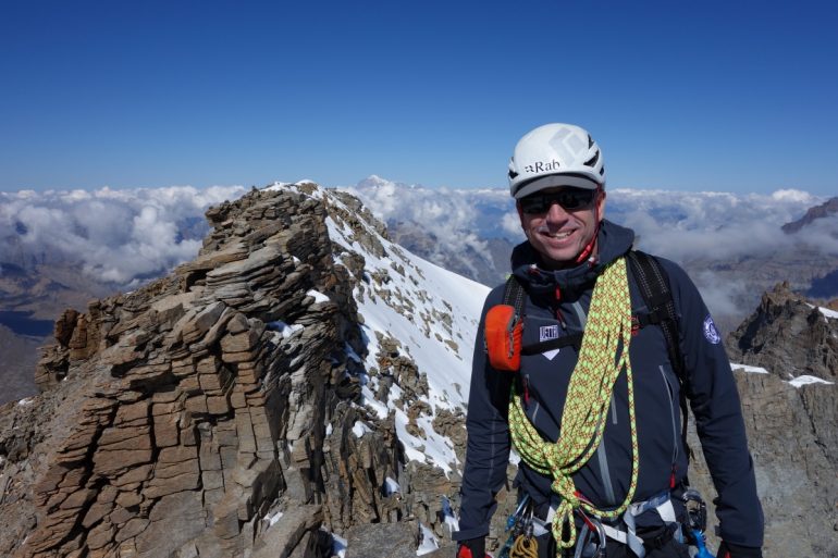 Rob on the summit of the Gran Paradiso, Mont Blanc in the background. Photo: 