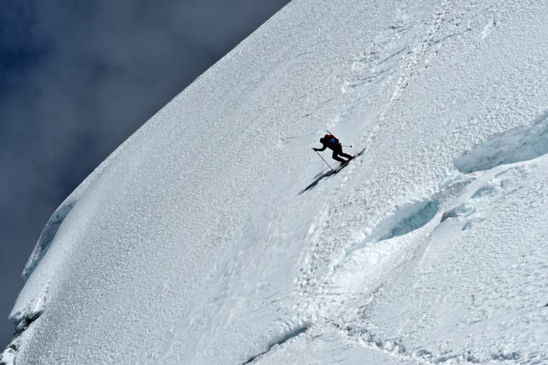 Mike Marolt skiing at the bottom of the summit headwall.
