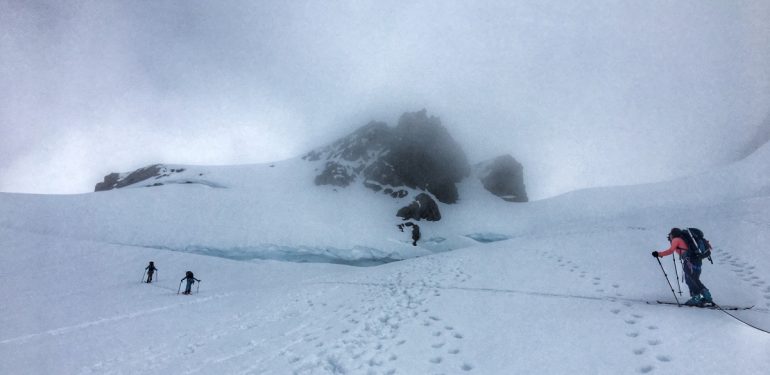 Approaching the summit, the slope to the summit is on the right slope of the photo. The route is in between two crevasse cracks.