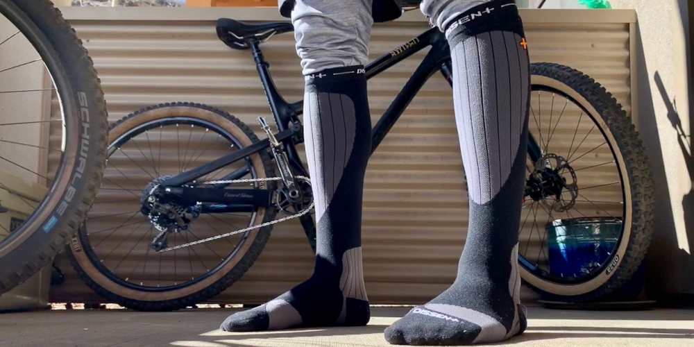Thin socks are crucial for ski touring. Compression socks like these Dissent socks are a great upgrade. Yes you can go medical grade here too.