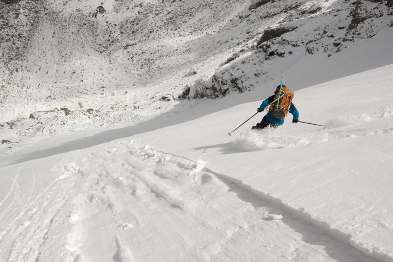 Joe Hughes enjoying fresh turns on the Navajo Snowfield below Apache Peak (13,409 ft).