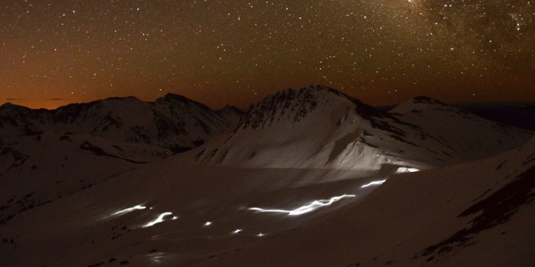 For many hours of the Grand Traverse, a line of headlamps snakes deep in the backcountry between Crested Butte and Aspen. Photo courtesy of Crested Butte Nordic.
