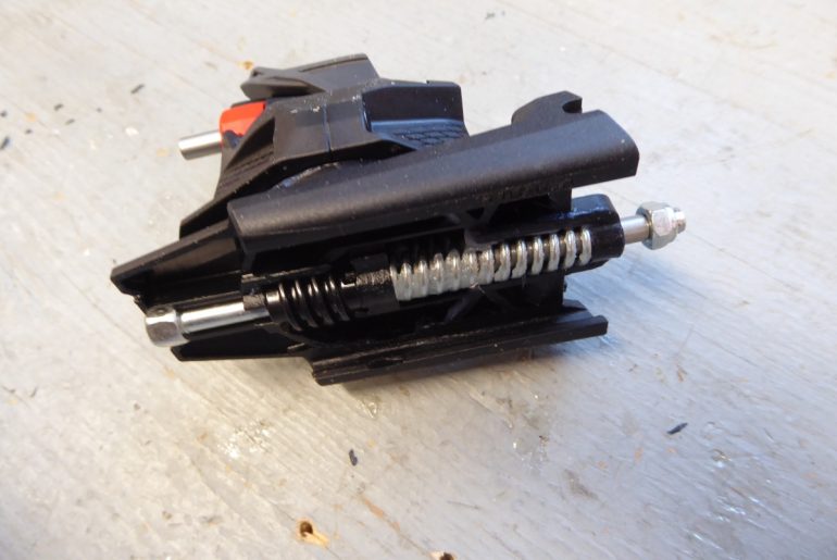 Underside of Xenic heel unit, showing ski flex compensation spring.